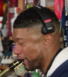Saxophone player: Final shot · navy top, pale hood
